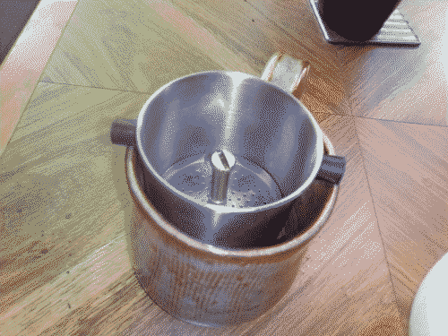 Vietnamese-style steel coffee filter with plunger screwed tight