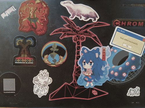 thinkpad X1C lid with stickers crowding for space. at bottom right, plunkins nestle in the brush by the power and sleep indicators (both lit up); the central space is dominated by a magenta and black wireframe palm tree with a chibi Shion Yorigami walking on its roots wit her begging bowl. behind her is a 3d wireframe doughnut with a windows-XP style messagebox above it that says [task failed successfully - ok]. above that is the chroma wheels logo; a badger sits atop the palm tree; on the left side of the tree are some more sparsely placed stickers: hundredrabbits logo and the uxn beet are along the bottom. above them are the mushroom blading logo and the planet earth with a rainbow halo being cradled by brown hands with a sprout growing out of the north pole, and at top-left by the upside-down thinkpad logo is a depicition of the goddess Kali, but as a hotdog
