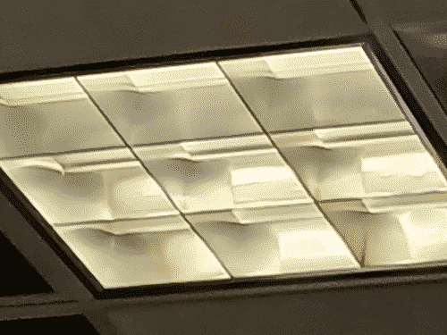 a 9x9 grid of eggshell white receeds into a grey cieling